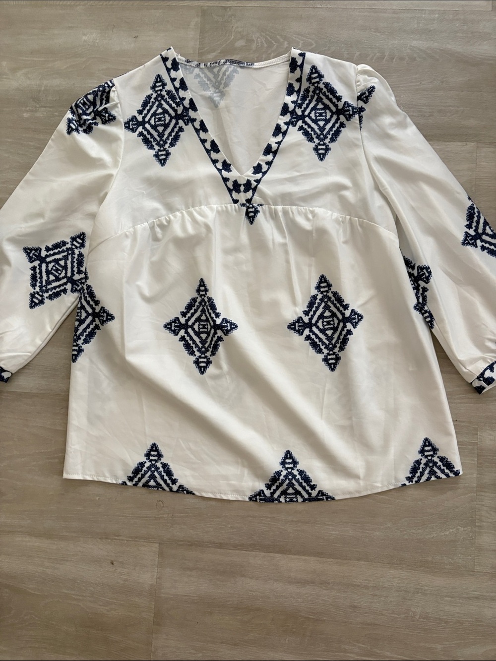 White V-Neck Embroidered Peasant Top with Navy Motifs